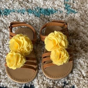 Brown sandal with yellow flower
